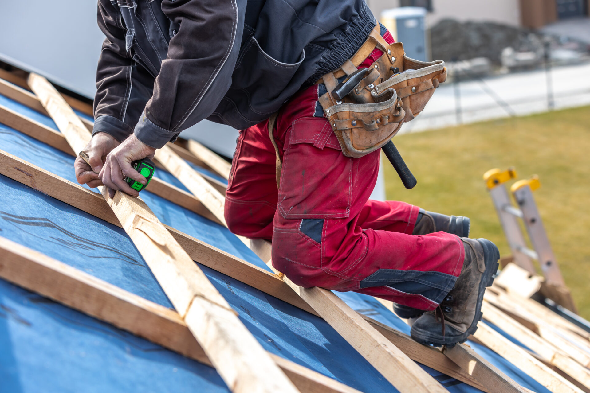 JOR Roofer measuring a roof during an installation